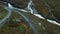 Flying drone view of cyclists riding up on road