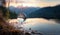 A flying drop of water macro against the backdrop of a mountain landscape and a lake. f pure natural drinking water