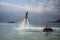 Flying on a flyboard on Winpearl beach with a view of the city of Nha Trang in Vietnam. January 18, 2020