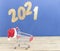 Flying in the form of New Year\\\'s numbers 2021 on a dark blue background. Happy New Year 2021 and Merry Christmas. Number