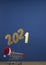 Flying in the form of New Year\\\'s numbers 2021 on a dark blue background. Happy New Year 2021 and Merry Christmas. Number