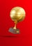 Flying golden basketball trophy cup on red background