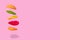 Flying Hamburger in layers, fast food on pastel pink background
