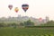 Flying hot air balloon over the mountains and tea plantation