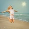 Flying jumping beach girl at blue sea shore