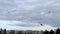 Flying kites against a dramatic autumn sky