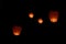 Flying lantern in the dark sky