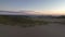 Flying low over deserted Tottori Sand Dunes on Sea of Japan coast at sunrise