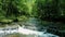 Flying low over mountain streams, landscape of the deep forest