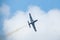 Flying military plane on a background of clouds