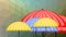 Flying multicolored umbrellas on polygonal background in rain, weather forecast intro,