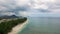 Flying over the beach with local and tourist people in Mauritius, Flic en Flac area. Many yacht and boats in water