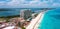 Flying over beautiful Cancun beach area. Aerial view of luxury hotels