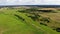 Flying over beautiful country side green landscape with field and trees, belarus nature, summer sunny, aerial shot