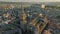 Flying over cathedral in Toledo, Spain. Magnificent architecture of the old city of Toledo in the sunset rays of the sun