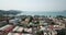 Flying over the city of Patong. Drone footage. View of colored houses