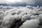 Flying over clouds in a plane, wing of the Airbus