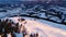 Flying over communications tower, mountain snow covered winter landscape.