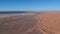 Flying over a Desert Dune near Village Merzouga in Morocco with Drone from above (Aerial)