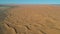 Flying over a Desert Dune near Village Merzouga in Morocco with Drone from above (Aerial)