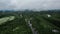 flying over a forest and river in the middle of the Swedish nature landscape with low hanging rain clouds