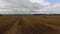 Flying over harvested field