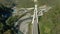 Flying over a high-speed highway in a mountain gorge above a stormy river