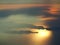 Flying over the island of Majorca during sunset. View from the airplane window. Mallorca, Spain