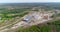 Flying over a large modern sawmill, the train stands near the sawmill view from the top. Modern woodworking factory