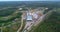 Flying over a large sawmill, the work of machinery on sawmills, flying over the warehouse of logs at the sawmill