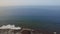 Flying over Maspalomas Lighthouse and ocean