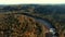 Flying over river and golden autumn forest. Sigulda, Latvia.