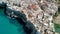 Flying over rooftops of Italian city of Polignano a Mare , Apulia