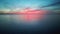 Flying Over Sea in a Beautiful Colorful Sunset. Aerial Drone Shoot. Sunrise Over the Sea.