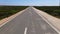 Flying over straight street in wilderness of Sagres, Portugal