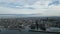 Flying over water towards harbor entrance and central Akashi City