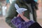 Flying paper bird origami held by a woman hand in winter closeup