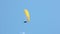 Flying paraglider on blue sky, freedom and adventure concept