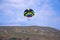 Flying paraglider in the mountain