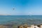 Flying paratrooper with full color parachute, isolated on a blue sky near Rhodes island, Greece