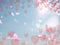 Flying red hearts on blue sky fluffy white clouds falling pink petals  background illustration template  copy space