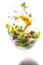 Flying Salad, Falling Salat Ingredients on Black Background