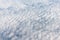 Flying in sky on altocumulus clouds, top view.