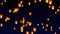 Flying sky lanterns in the night sky