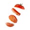 Flying, sliced red fresh tomato on a white background. Levitation of tomato slices. Isolated