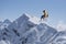 Flying snowboarder on mountains