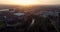 Flying in spring at sunset over the Kelvingrove park in Glasgow, Scotland towards the Gilbert Scott tower at Glasgow University