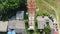 Flying straight down from top to horizontal over a telecommunication tower distribution with nature background