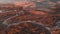 Flying during sunrise over the mountain steppe in autumn light yellow trees in Altai