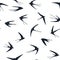 Flying swallows birds silhouettes vector seamless pattern graphic design.
